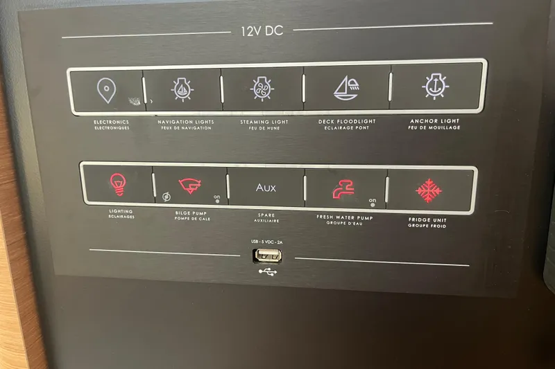 Slide: The Image of Control panel of 2023 Jeanneau Sun Odyssey 380 yacht, featuring various electronic functions. - 18