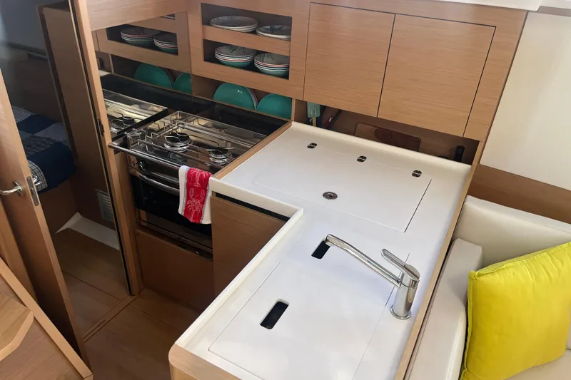 Slide: The Image of Modern kitchen interior of 2023 Jeanneau Sun Odyssey 380 yacht with stove and sink. - 19