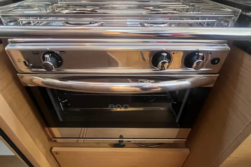 Slide: The Image of Stainless steel oven in 2023 Jeanneau Sun Odyssey 380 yacht kitchen. - 25