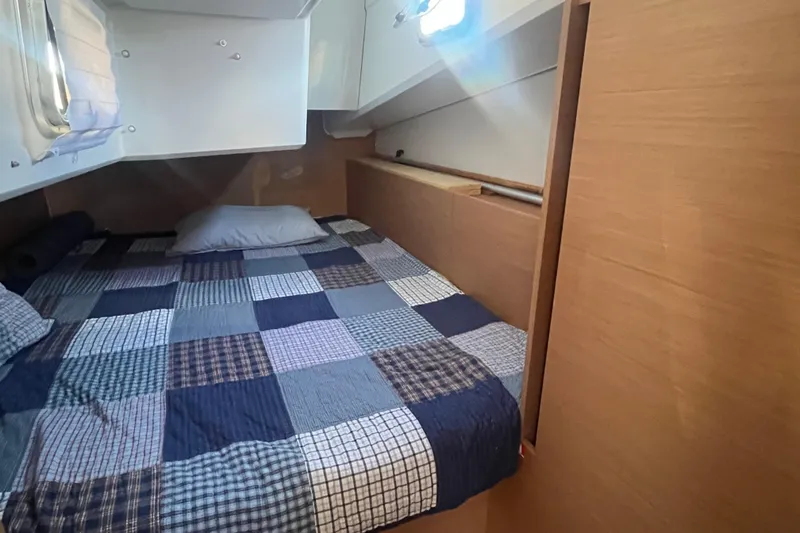 Slide: The Image of Interior of Jeanneau Sun Odyssey 380, 2023, featuring a cozy bed. - 26