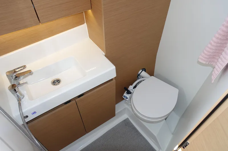 Slide: The Image of Modern bathroom in 2023 Jeanneau Sun Odyssey 380 yacht with sink and toilet. - 30