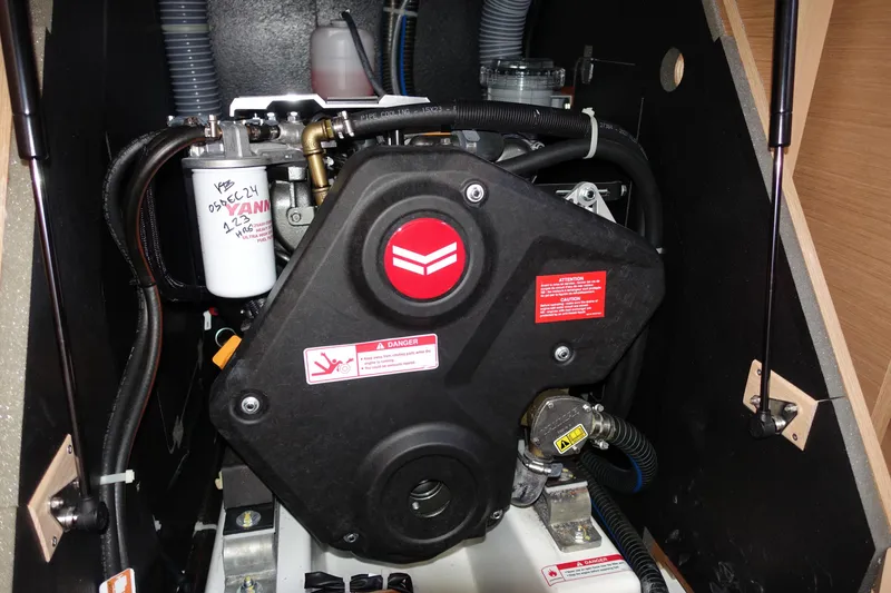 Slide: The Image of Engine compartment of 2023 Jeanneau Sun Odyssey 380 sailboat, showcasing mechanical components. - 32