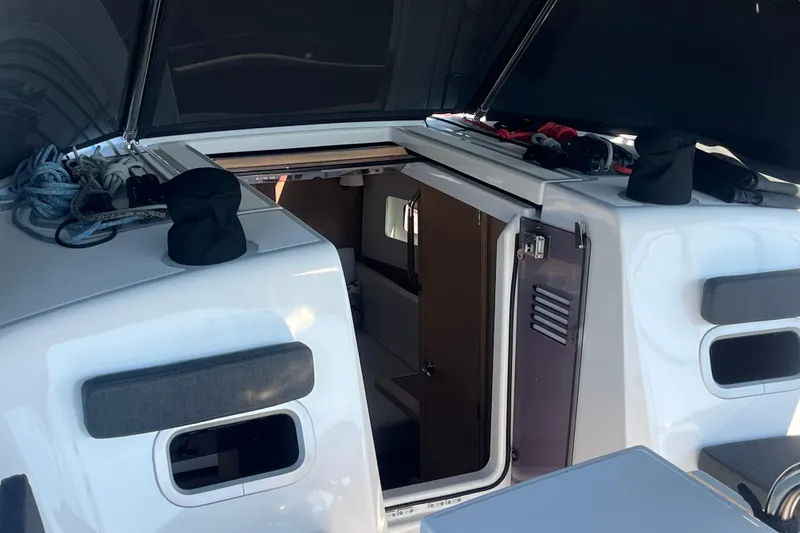 Slide: The Image of 2023 Jeanneau Sun Odyssey 380 yacht cockpit with open hatch and visible interior. - 33