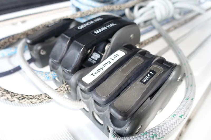 Slide: The Image of Close-up of sailing rope clutches on a 2023 Jeanneau Sun Odyssey 380 yacht. - 34