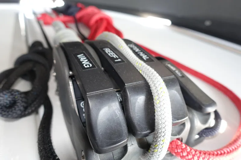 Slide: The Image of Close-up of sailing ropes and clutches on a 2023 Jeanneau Sun Odyssey 380 yacht. - 35
