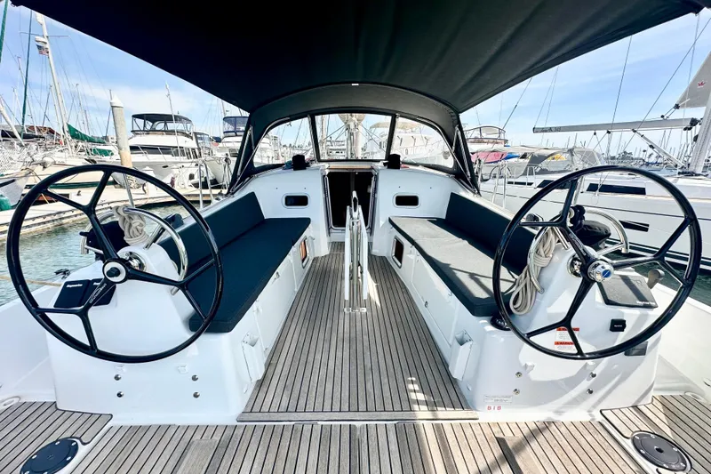 Slide: The Image of 2023 Jeanneau Sun Odyssey 380 cockpit with dual steering wheels and sleek design. - 37