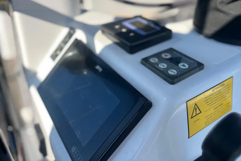Slide: The Image of Control panel of 2023 Jeanneau Sun Odyssey 380 sailboat, featuring navigation and control buttons. - 38