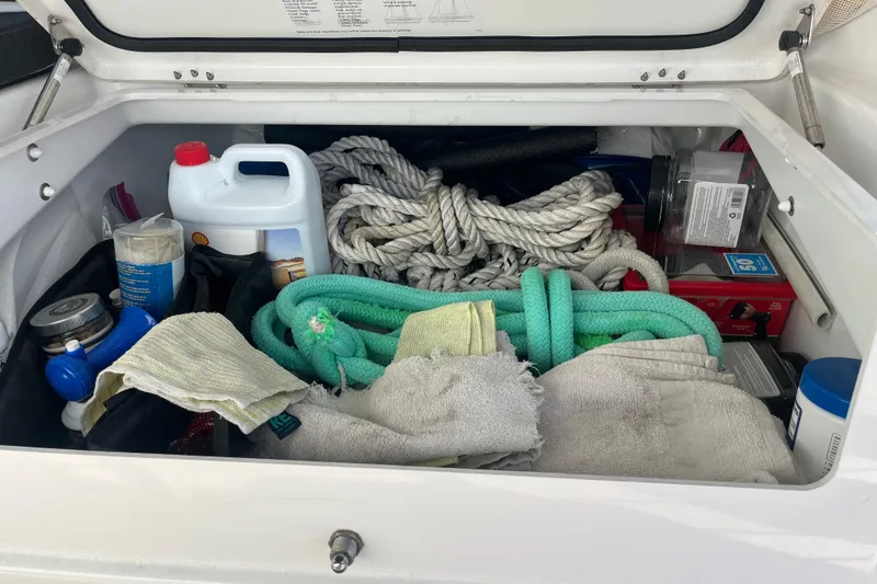 Slide: The Image of Storage compartment of 2023 Jeanneau Sun Odyssey 380 with ropes and maintenance supplies. - 42
