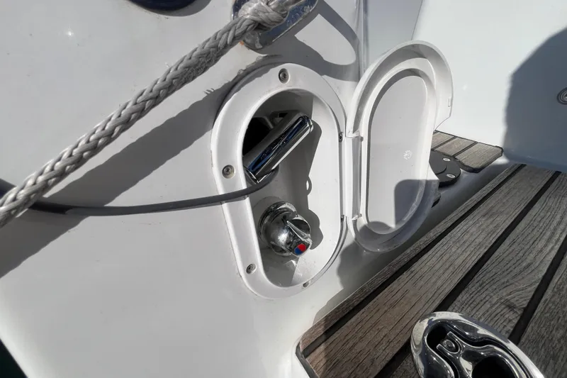 Slide: The Image of Jeanneau Sun Odyssey 380, 2023 model, deck detail with open compartment and rope. - 47