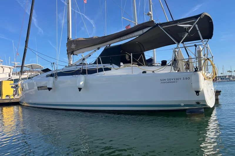 Slide: The Image of 2023 Jeanneau Sun Odyssey 380 sailboat docked in marina, featuring sleek design and modern amenities. - 63