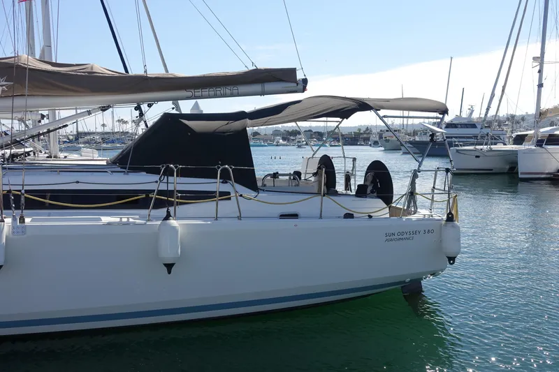 Slide: The Image of 2023 Jeanneau Sun Odyssey 380 sailboat docked in a marina, side view. - 67