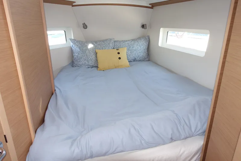Slide: The Image of Cozy cabin interior of 2023 Jeanneau Sun Odyssey 380 with comfortable bedding and natural light. - 7