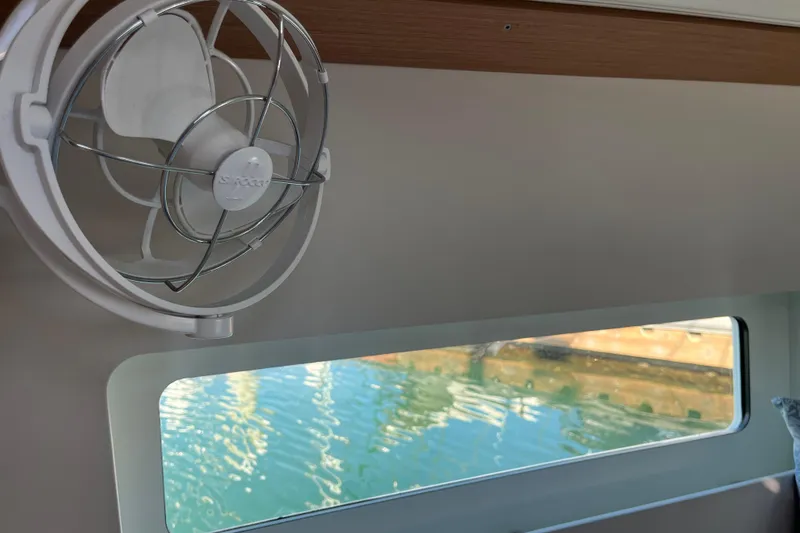 Slide: The Image of Interior of 2023 Jeanneau Sun Odyssey 380 with fan and window view. - 8