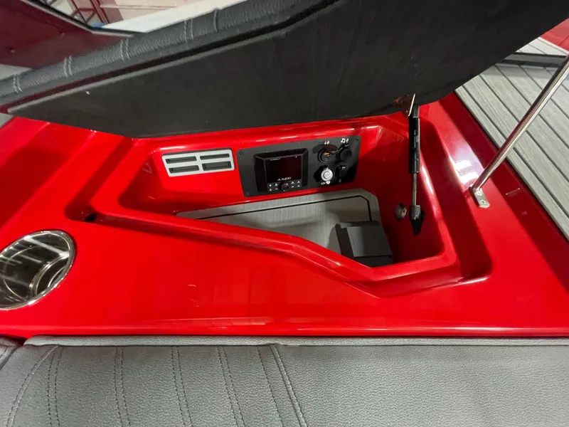 Slide: The Image of Interior view of 2026 Nautique Ski Nautique boat, red console. - 18