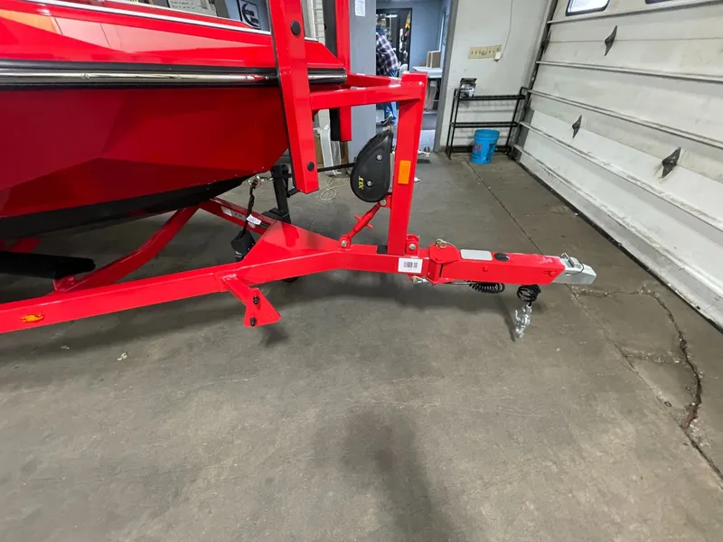 Slide: The Image of Red 2026 Nautique Ski Nautique trailer in garage. - 4