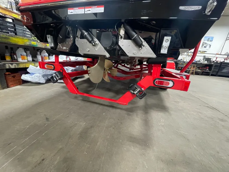 Slide: The Image of Rear view of 2026 Nautique Ski Nautique boat on red trailer. - 6