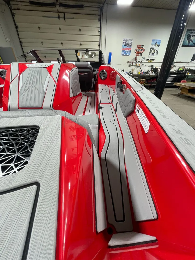 Slide: The Image of Interior of 2026 Nautique Ski Nautique boat, red and gray. - 9