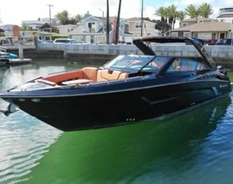 The Image of 2021 Cruisers Yachts 338 SS Outboard in a harbor. - 0