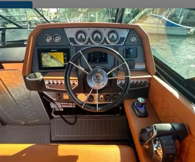 Slide: The Image of Cockpit of 2021 Cruisers Yachts 338 SS Outboard South Beach. - 10