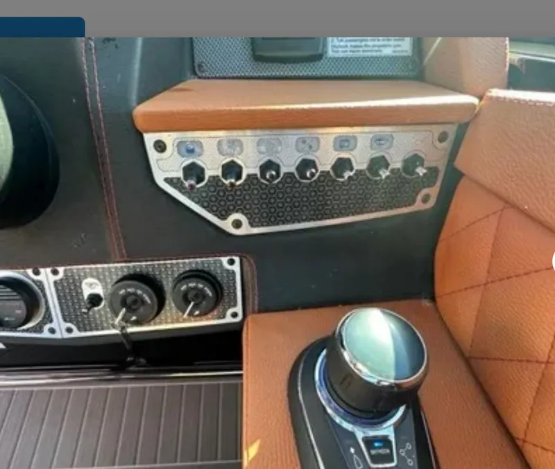Slide: The Image of Dashboard of 2021 Cruisers Yachts 338 SS Outboard with controls. - 11