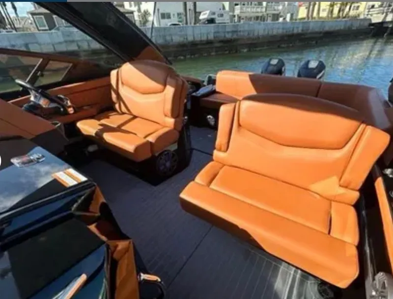 Slide: The Image of Interior of 2021 Cruisers Yachts 338 SS Outboard South Beach with leather seats. - 12