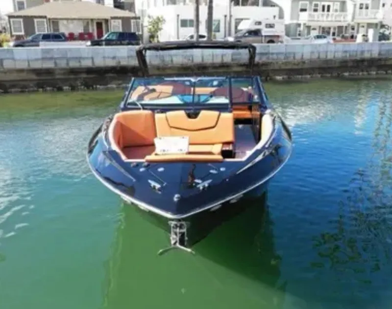 Slide: The Image of 2021 Cruisers Yachts 338 SS Outboard in a harbor. - 3