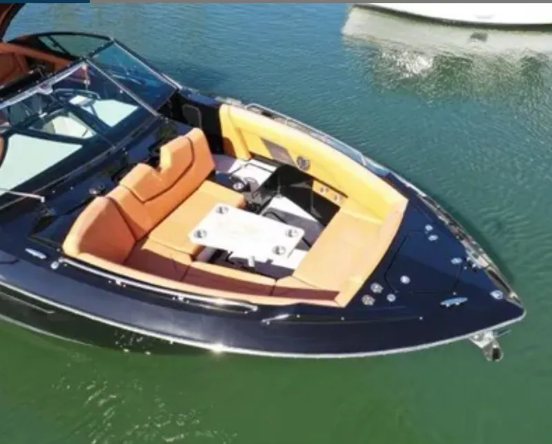 Slide: The Image of 2021 Cruisers Yachts 338 SS Outboard on calm water. - 5
