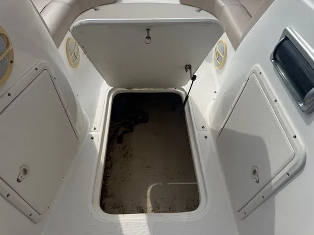 Slide: The Image of Open storage compartment on a 2014 Hurricane SSR188 boat. - 12