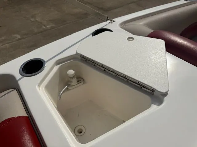 Slide: The Image of Hurricane SSR188 2014 boat with open storage compartment and red seats. - 17