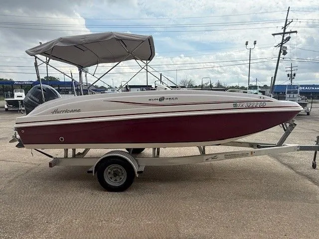 Slide: The Image of 2014 Hurricane SSR188 boat on trailer, red and white design. - 6
