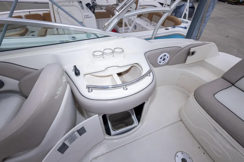 Slide: The Image of Interior view of a 2002 Sea Ray 270 Sundeck boat with seating and storage. - 11