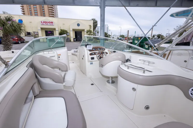 Slide: The Image of Interior view of a 2002 Sea Ray 270 Sundeck boat with seating and control panel. - 15