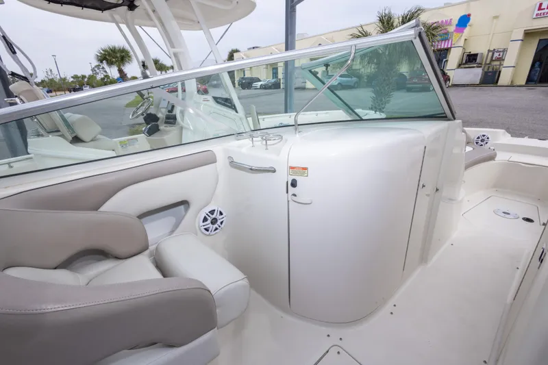 Slide: The Image of Interior view of a 2002 Sea Ray 270 Sundeck boat, featuring seating and dashboard. - 17