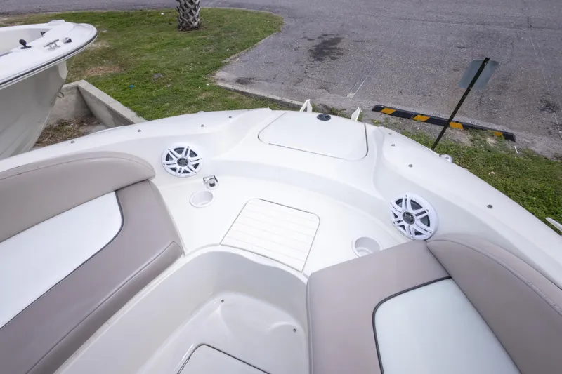 Slide: The Image of 2002 Sea Ray 270 Sundeck boat interior with seating and speakers. - 23