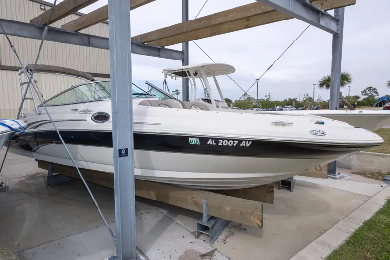 Slide: The Image of 2002 Sea Ray 270 Sundeck boat on a storage rack, side view. - 27