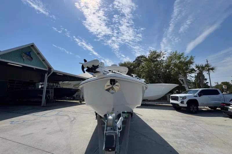 Slide: The Image of 2023 Everglades 273 Center Console boat on trailer, sunny day, dealership background. - 7