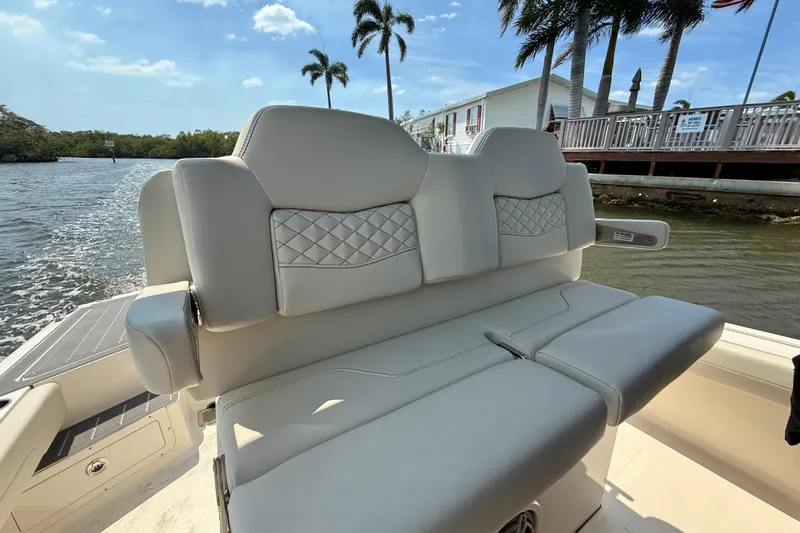 Slide: The Image of Luxurious seating on 2026 Scout 281 XSS boat, with scenic waterfront view. - 18