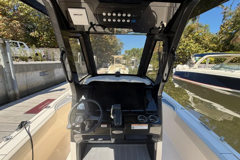 Slide: The Image of Interior view of 2026 Scout 281 XSS boat cockpit with steering wheel and controls. - 9