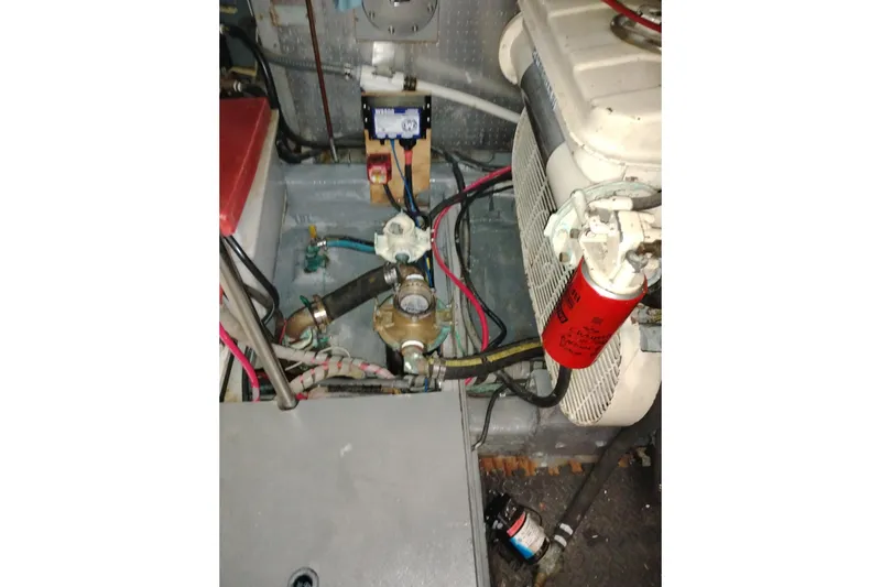 Slide: The Image of Engine room of 1988 PT 52 AFT Cabin Motor Yacht with visible components and wiring. - 104