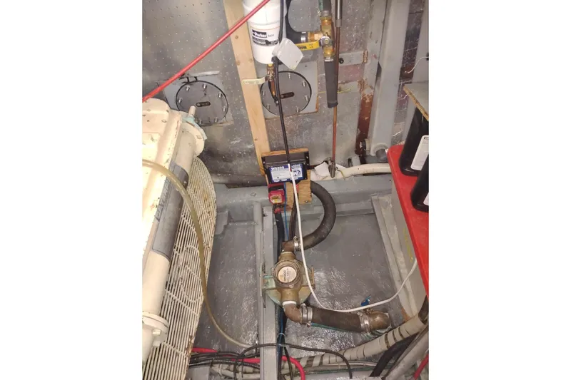 Slide: The Image of Engine room of 1988 PT 52 AFT Cabin Motor Yacht with mechanical components. - 109