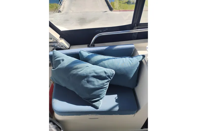 Slide: The Image of Blue cushioned seating area on 1988 PT 52 AFT Cabin Motor Yacht. - 12