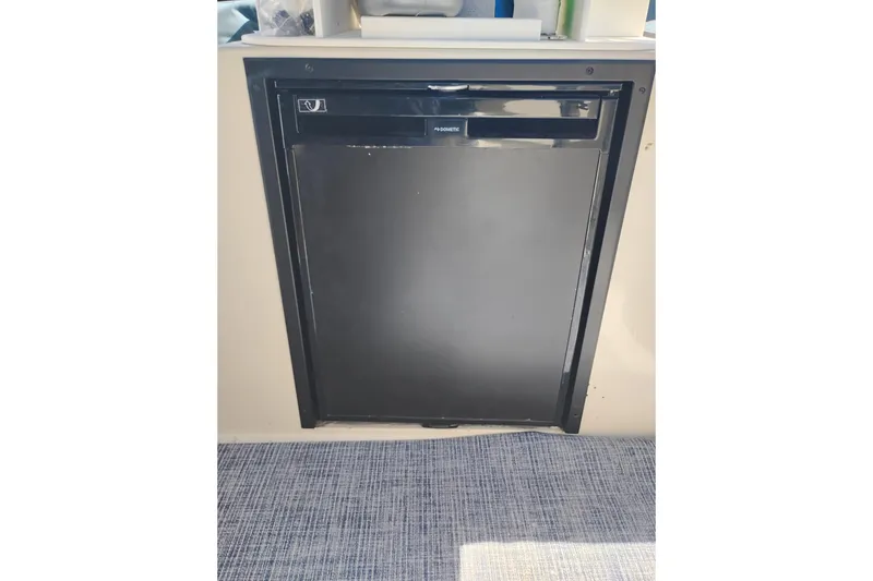 Slide: The Image of Black Dometic refrigerator on 1988 PT 52 AFT Cabin Motor Yacht. - 13