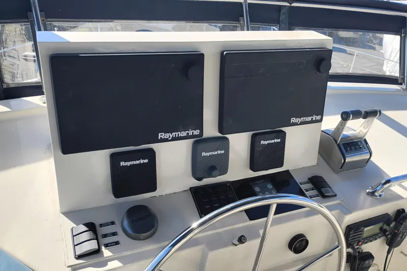 Slide: The Image of Control panel of 1988 PT 52 AFT Cabin Motor Yacht with Raymarine equipment. - 15