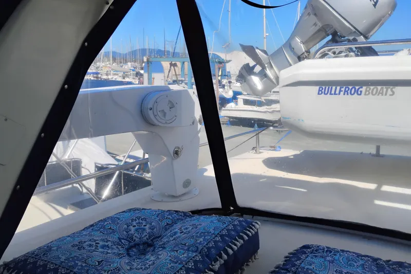 Slide: The Image of 1988 PT 52 AFT Cabin Motor Yacht interior with marina view and Bullfrog Boats equipment. - 27