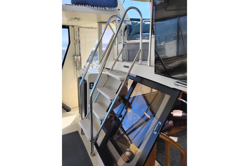 Slide: The Image of Interior view of 1988 PT 52 AFT Cabin Motor Yacht with stairs and railing. - 31