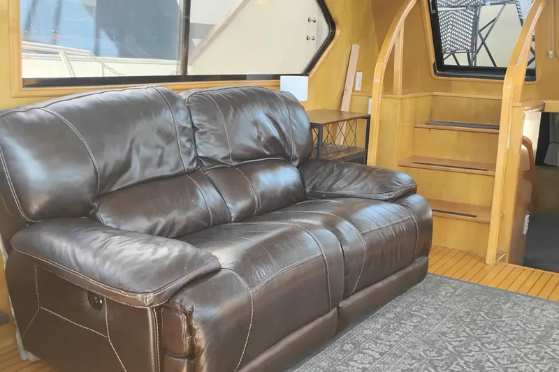Slide: The Image of Luxurious leather sofa in 1988 PT 52 AFT Cabin Motor Yacht interior. - 33