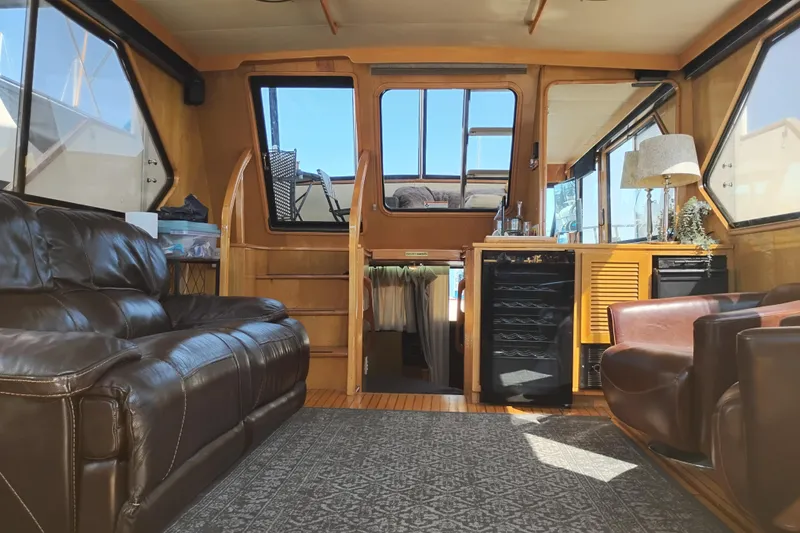 Slide: The Image of Interior of 1988 PT 52 AFT Cabin Motor Yacht with leather seating and wooden accents. - 34