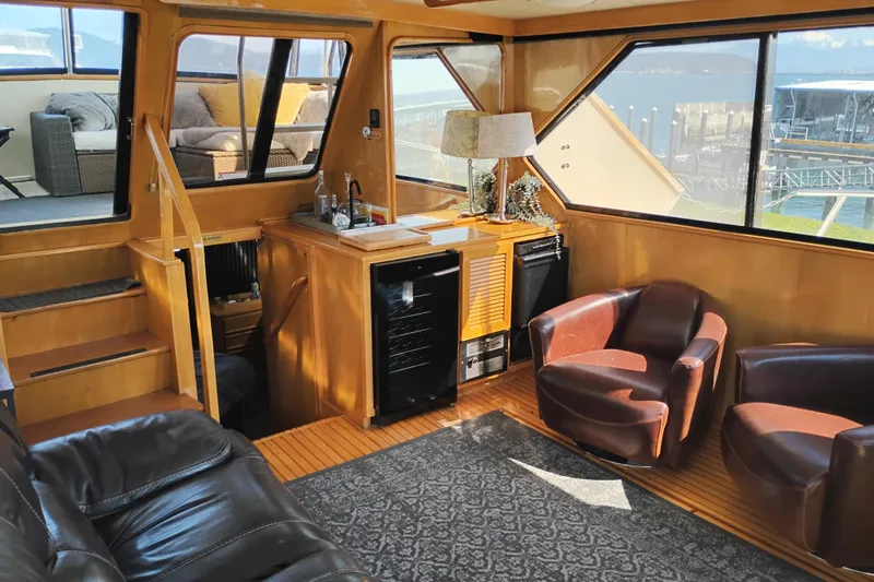 Slide: The Image of Interior of 1988 PT 52 AFT Cabin Motor Yacht with leather seating and bar area. - 35