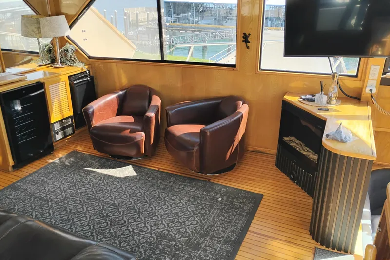 Slide: The Image of Interior of 1988 PT 52 AFT Cabin Motor Yacht with leather chairs and modern decor. - 40