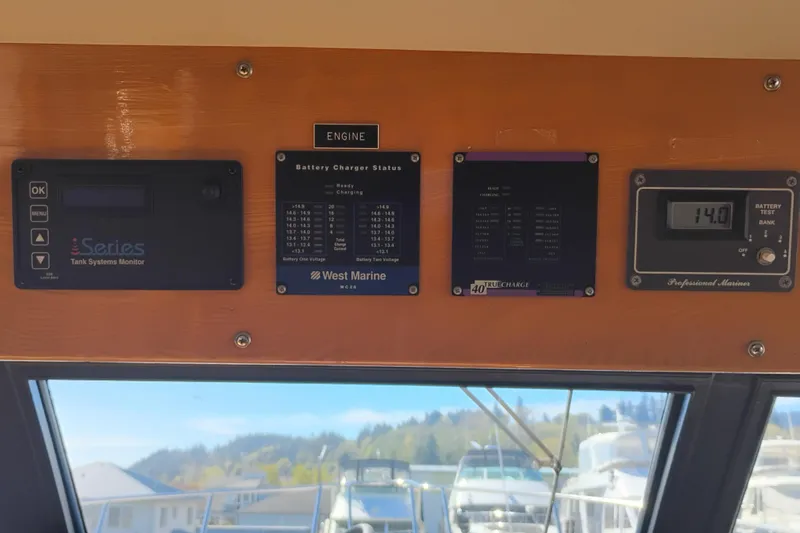 Slide: The Image of Control panel of a 1988 PT 52 AFT Cabin Motor Yacht with battery monitors. - 51